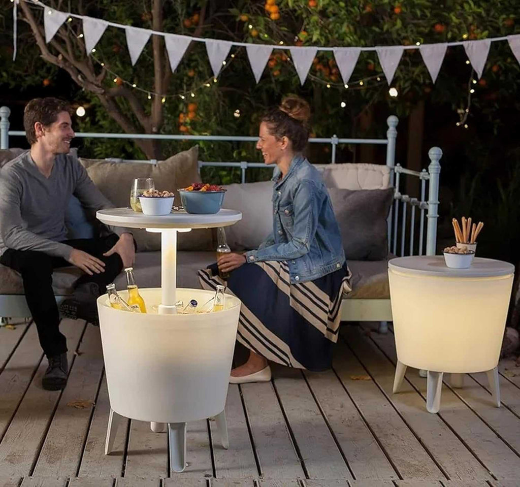 Illuminated outdoor cool bar ice cooler table with built-in cooler and glowing tabletop for garden or patio use