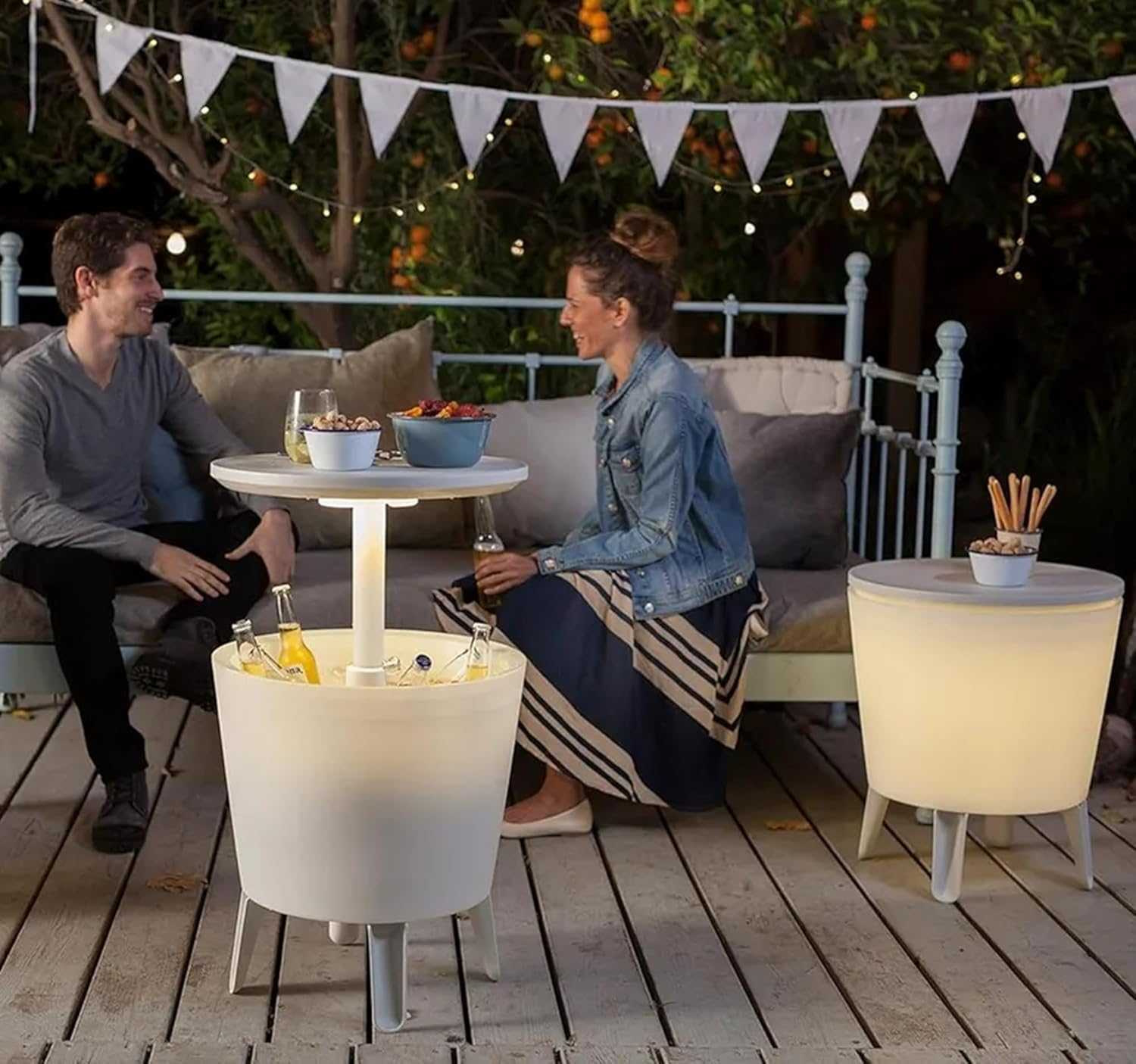Illuminated outdoor cool bar ice cooler table with built-in cooler and glowing tabletop for garden or patio use