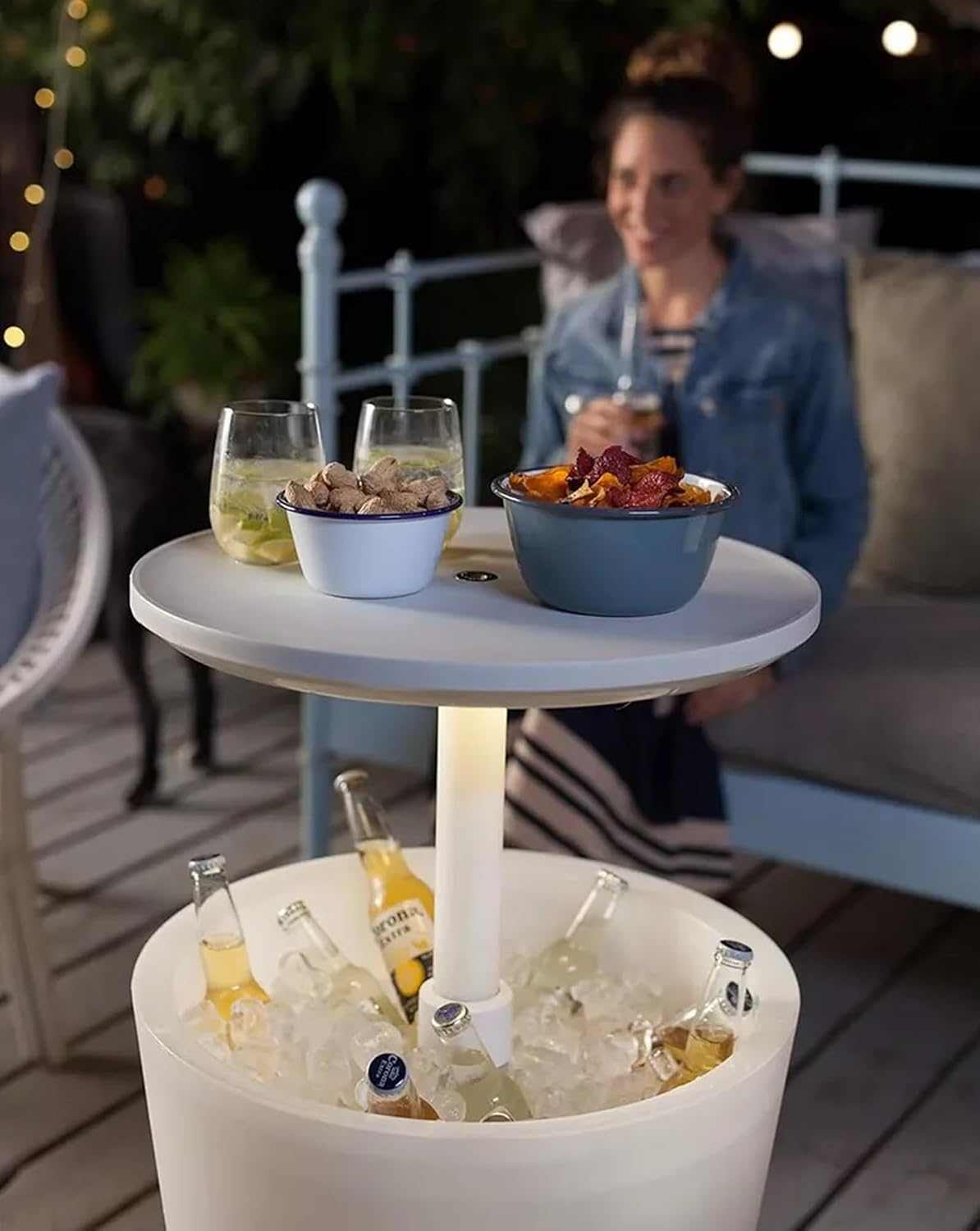 Illuminated outdoor cool bar ice cooler table with built-in cooler and glowing tabletop on patio
