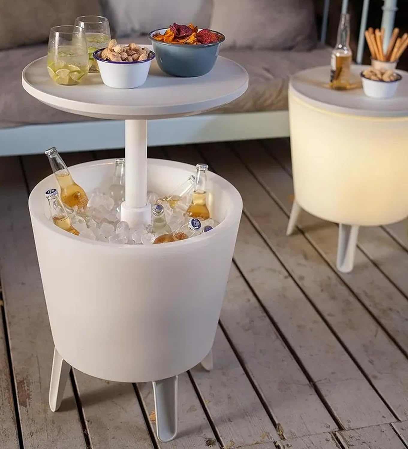 Illuminated outdoor cool bar ice cooler table with built-in cooler and ambient lighting on patio
