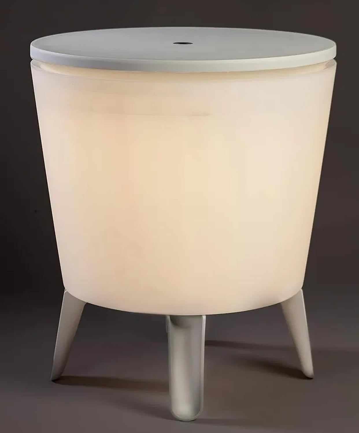 Illuminated outdoor cool bar ice cooler table with built-in ice storage and glowing tabletop for garden or patio use
