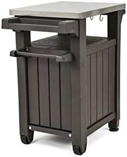 Outdoor garden kitchen with mobile serving station, stainless steel worktop, and organized storage