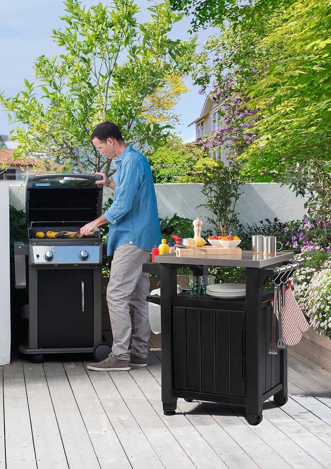 Outdoor garden kitchen food station with storage and stainless steel worktop on castors for easy mobility