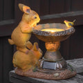 Solar rabbit bird bath garden statue with hand-painted details and solar-powered LED light