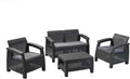 Outdoor rattan 4 seater sofa set with reclined cushions and coordinating accent table on patio