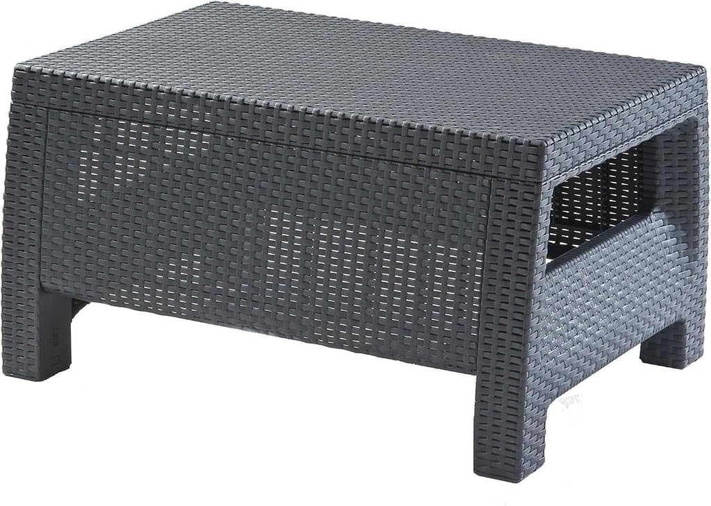 Outdoor rattan 4 seater sofa set with reclining cushions and coordinating accent table in garden setting