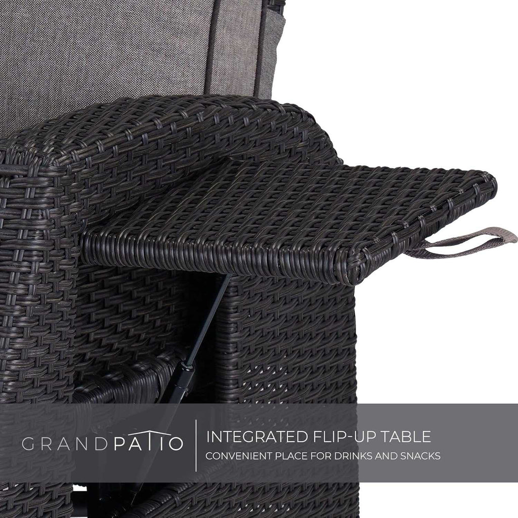 Outdoor reclining wicker lounge chair with cushion and built-in flip-up side table on patio
