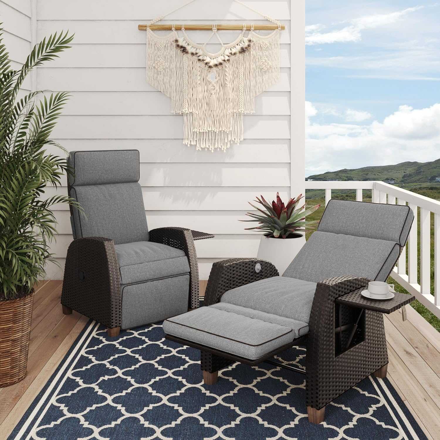 Outdoor reclining wicker lounge chair with cushion and flip-up side table on patio