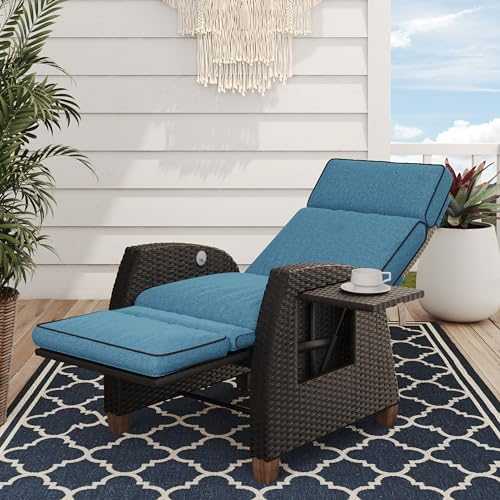 Outdoor reclining wicker lounge chair with cushion and flip-up side table on patio