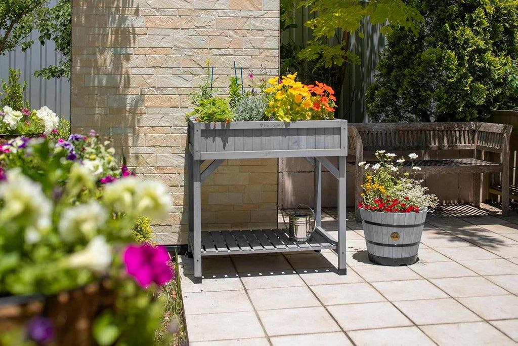 8-Pocket Raised Herb Planter in grey wash wood with eight compartments for growing fresh herbs at accessible height