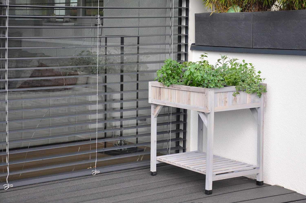 8-Pocket Raised Herb Planter grey wash wood with eight pockets for herbs on patio